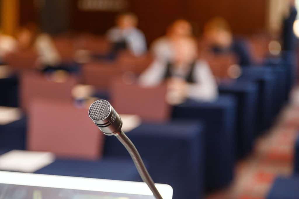 Microphone over conference hall background